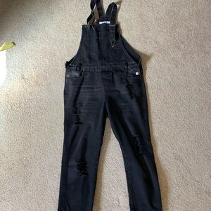 Distressed black denim overalls